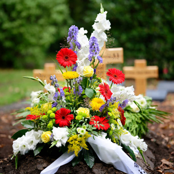 istock colorful flowers on grave after burial 1426021540