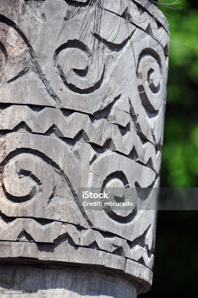 A 'uma fukun' sacred house - carved capital, Liquiça, East Timor Liquiça / Likisa, East Timor / Timor Leste: traditional wood carving - capital of a column at the 'uma fukun', a traditional Timorese sacred ritual house / shrine, home of powerful ancestors' spirits, links all families of the same lineage together in harmony, an essential point of reference for tribal union. Outdoors Stock Photo
