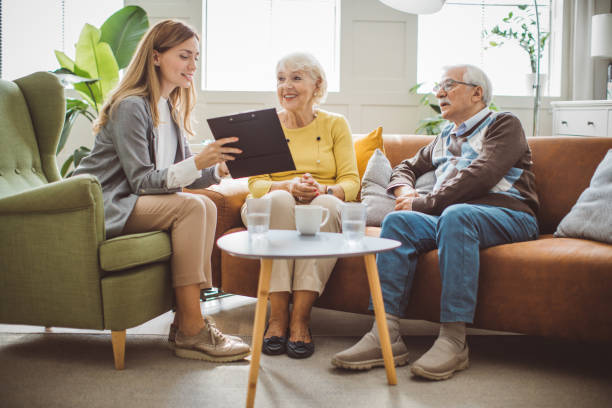 istock Senior couple consulting with female advisor 1426024321