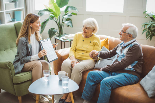 istock Senior couple consulting with female advisor 1426024364