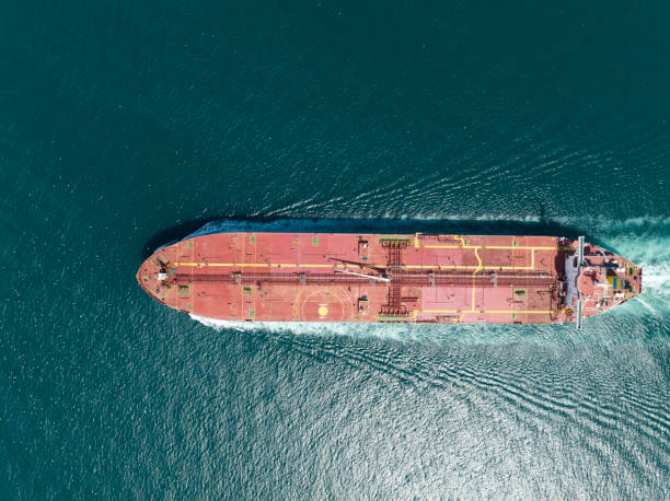 istock Cargo ship in import export and business logistic, Logistic and transportation of International Container Cargo ship in the open sea, Aerial shot from drone. 1426024445