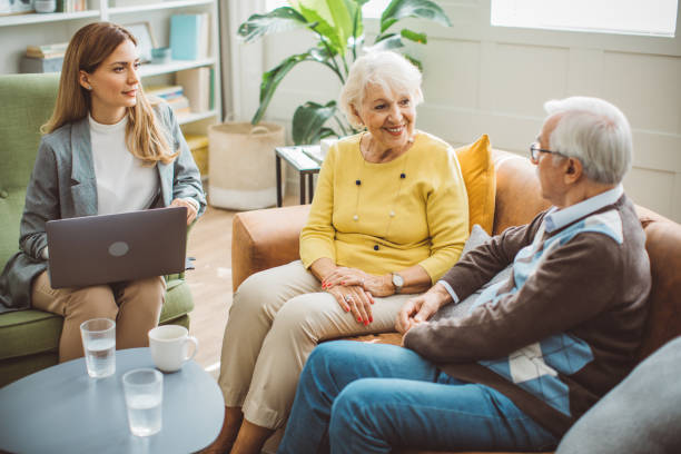 istock Senior couple consulting with female advisor 1426024449