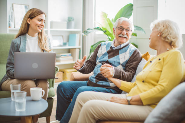 istock Senior couple consulting with female advisor 1426024488