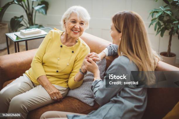Senior Woman Talking With Daughter Stock Photo - Download Image Now - Daughter, Listening, Mother
