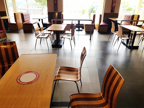 Empty dining tables in a restaurant.