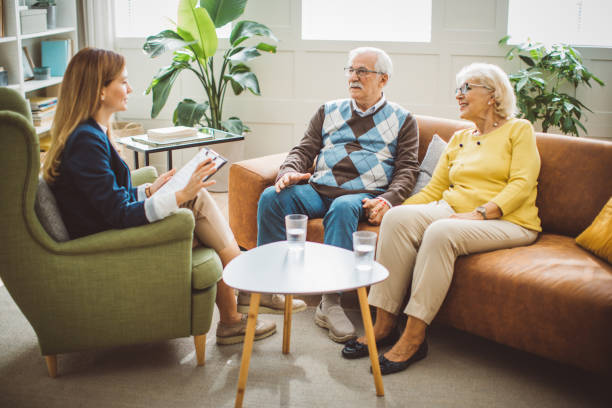istock Senior couple consulting with female advisor 1426025577