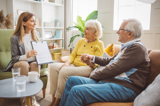 istock Senior couple consulting with female advisor 1426025785