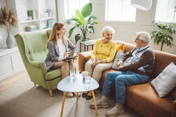 istock Senior couple consulting with female advisor 1426025787