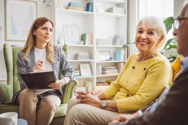 istock Senior couple consulting with female advisor 1426025900