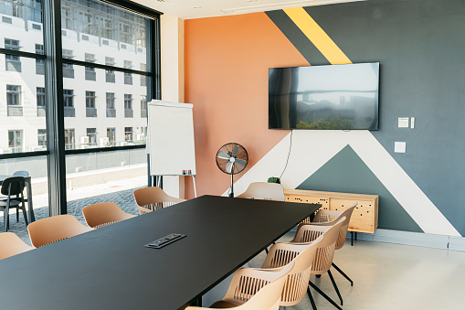 Empty boardroom office in creative startup agency for meetings, presentation and conference talk. Business background, interior planning space and workshop room team training, seminar and convention