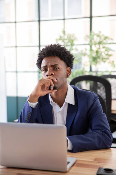 portrait of skeptical male office worker - business person suspicion clothing well dressed imagens e fotografias de stock