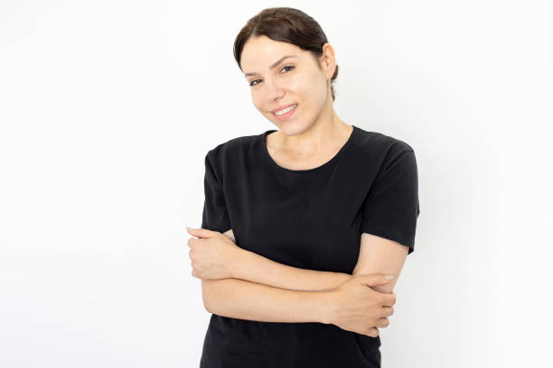 istock Cheerful woman with folded arms against white background 1426027353