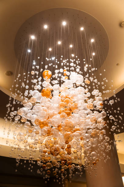istock round lamps on long cords, conceptual chandelier 1426039089