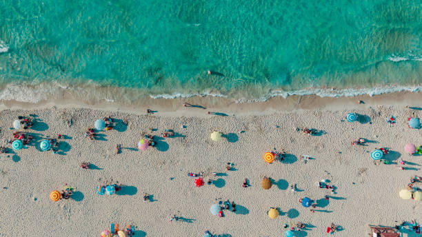aerial drone view of ilıca beach, cesme, izmir - high angle view people people in a row directly above imagens e fotografias de stock