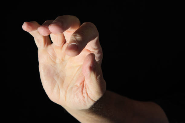 istock Spot Lit Human Hand Palm and Fingertips Facing Camera 1426050001