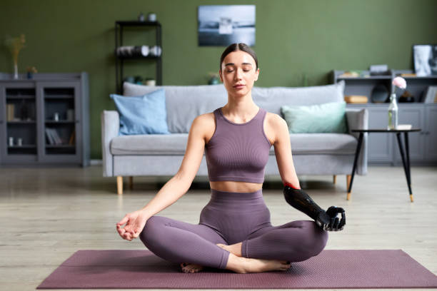 istock Woman doing yoga at home 1426056661