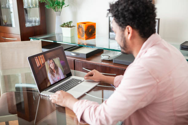 African American young man doing online psychotherapy at home African American young man doing online psychotherapy at home teleheath therapy stock pictures, royalty-free photos & images