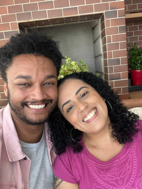 istock Heterosexual couple making selfie at home. POV 1426068025