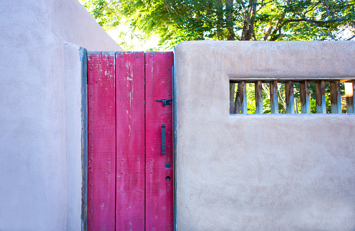 The peak of Taos Mountain is Taos, NM is snow capped. Below the mountain which is located in the Sangre de Cristo mountain range, the ancient Taos Pueblo sits. This pueblo is considered to be one of the oldest continuously inhibited communities in the US.