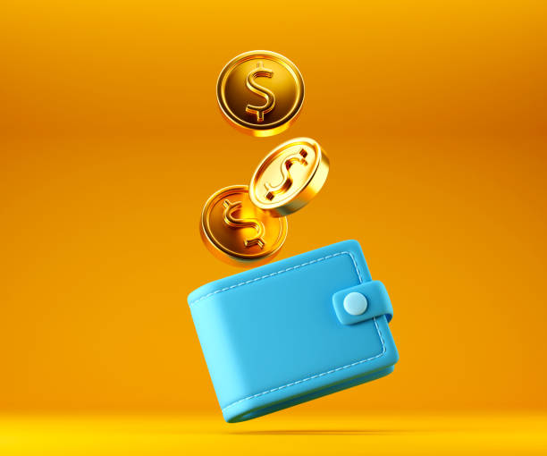 istock Blue wallet with falling golden dollar coins on bright yellow background 1426076472