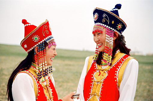 China has a large Mongolian population, mainly in the Inner Mongolia region bordering Mongolia.Naadam is the Mongolian annual most solemn national festival. People dress up and take part in festival activities. Film photo in 28 July 1997, Sonid Youqi, Inner Mongolia, China