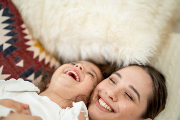 istock Mother and daughter laughing together 1426080658
