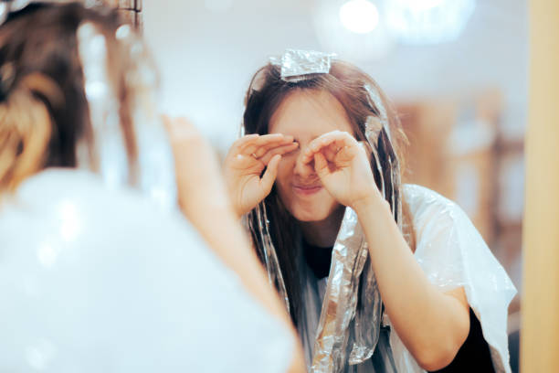 Woman Feeling her Eyes Hurt Being Allergic to Hair Product Hair salon customer having an allergic reaction to hydrogen peroxide hydrogen peroxide stock pictures, royalty-free photos & images