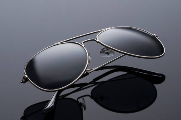 istock sunglasses are black from ultraviolet light on a black background. style and vision protection 1426095006