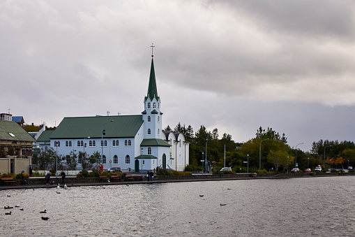 Church building at Tjörnin city pond in Reykjavik, Iceland