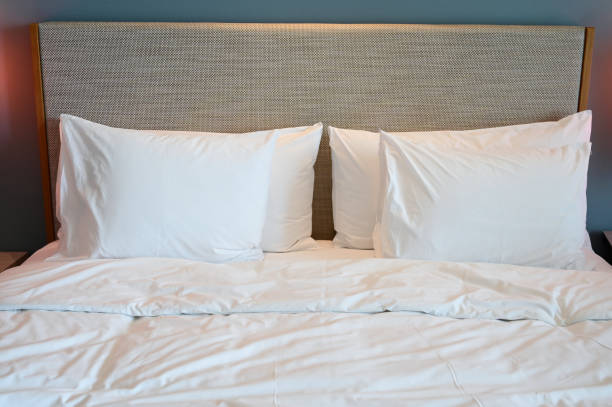 istock white bed and pillows in the room 1426096000