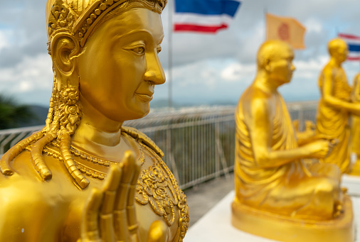 Golden Buddhist statues near Big Buddha in Phuket, Thailand