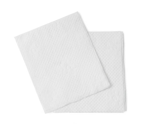 istock Two folded pieces of white tissue paper or napkin in stack isolated on white background with clipping path 1426101671