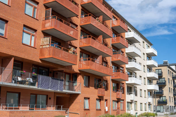 istock Red and white apartment buildings with many balconies 1426104524