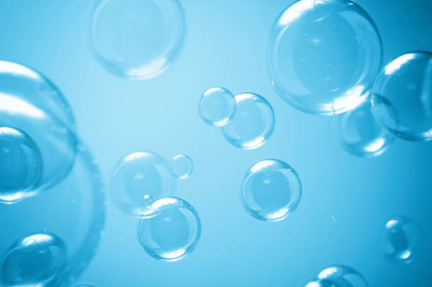 istock Abstract Beautiful Transparent Blue Soap Bubbles Background. Soap Sud Bubbles Water. 1426110801