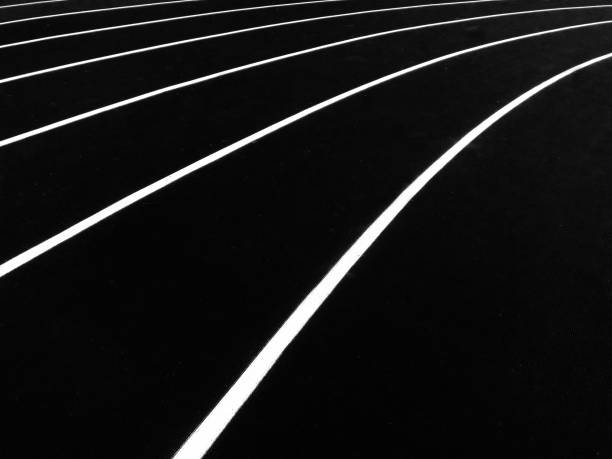 Flat black metal bars with metalic and gray edges due to wear and tear
