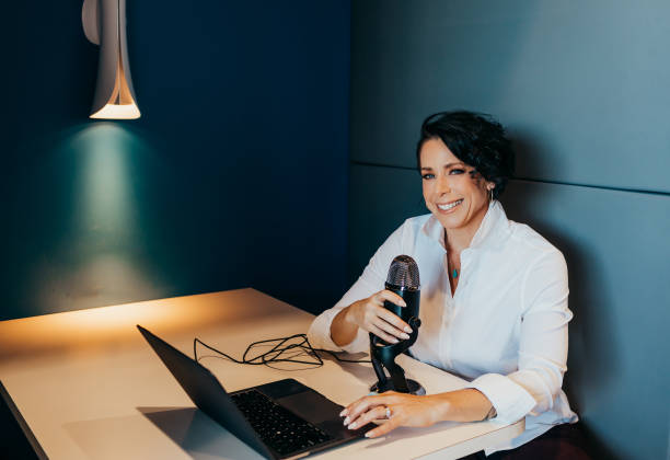 istock Woman works on computer with microphone 1426118457