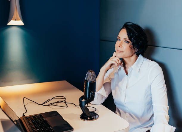 istock Woman works on computer with microphone 1426118498