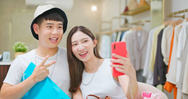 istock asian couple taking selfie 1426119820