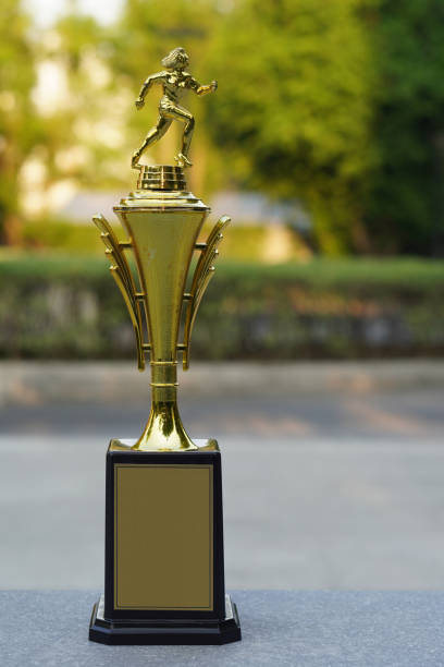 istock front view golden cup on marble floor, blur nature background, nature, decor, gift, object, vintage, copy space 1426121462