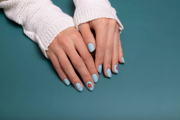 istock Winter blue manicure gel polish with stickers under a matte top 1426122100