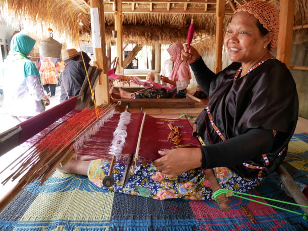 Women are weaving in the village of Sukarara, Lombok Indonesia stock photo