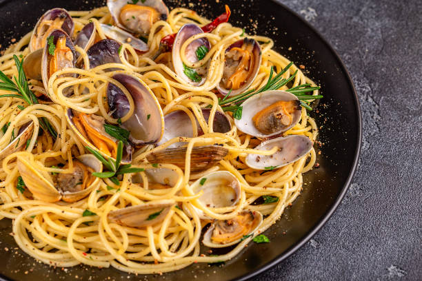 istock Seafood pasta with clams Spaghetti alle Vongole on a light background 1426123904