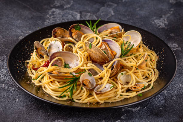 istock Seafood pasta with clams Spaghetti alle Vongole on a light background 1426124184
