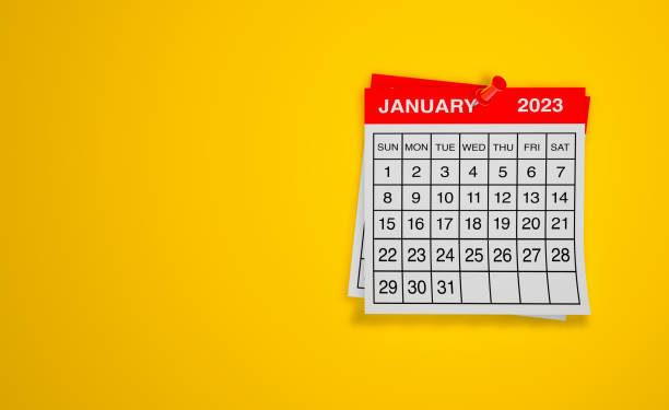 January 2023 calendar on yellow background stock photo