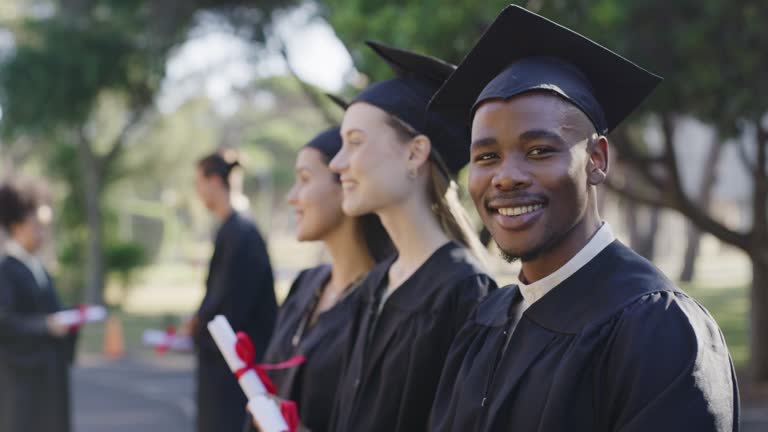 Graduation, success and happy graduate excited by a degree or diploma at a campus celebration. Portrait of an African American masters or PhD student graduating at a ceremony or event