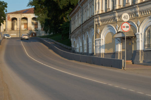 istock Curved road with road signs in small town 1426130830