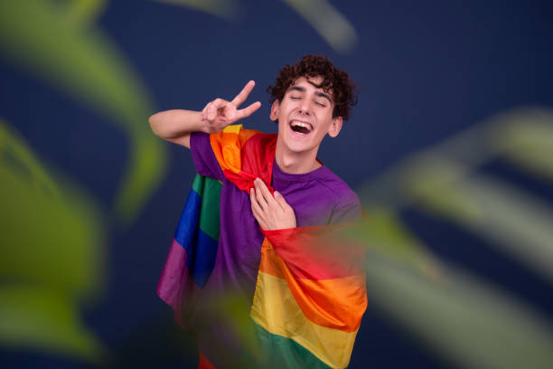 istock Happy guy with a gay flag in his hands. 1426131583