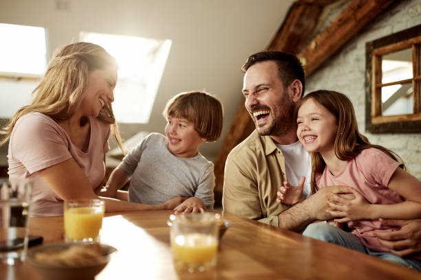 istock Cheerful family having fun while talking at home. 1426138623