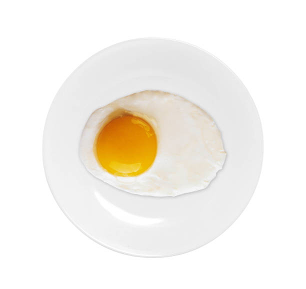 istock Top view of white dish with fried egg 1426142072