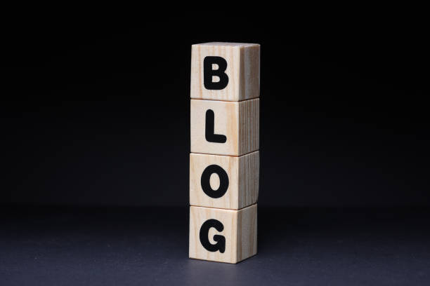 Word blog from wooden blocks on black background